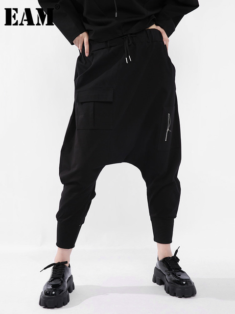 Wysokie, elastyczne spodnie capri o podziale w kolorze czarnym - nowa, luźna moda na wiosnę i jesień 2022 - tanie ubrania i akcesoria
