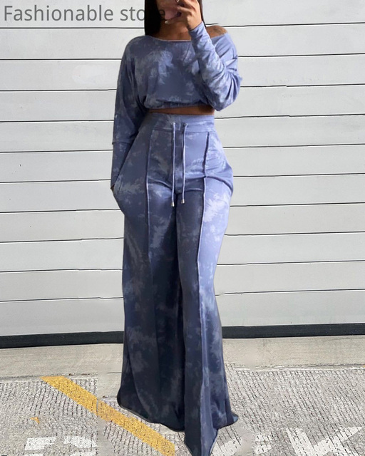 Kobiecy top z długim rękawem i głębokim dekoltem w barwne nadruki oraz szerokie spodnie z wysokim wiązaniem w talii - 2 sztuki - tanie ubrania i akcesoria