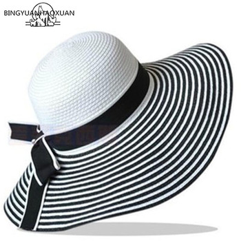 Czarny kapelusz słomkowy z białymi paskami i kokardką - gorąca sprzedaż wiosennej mody dla kobiet